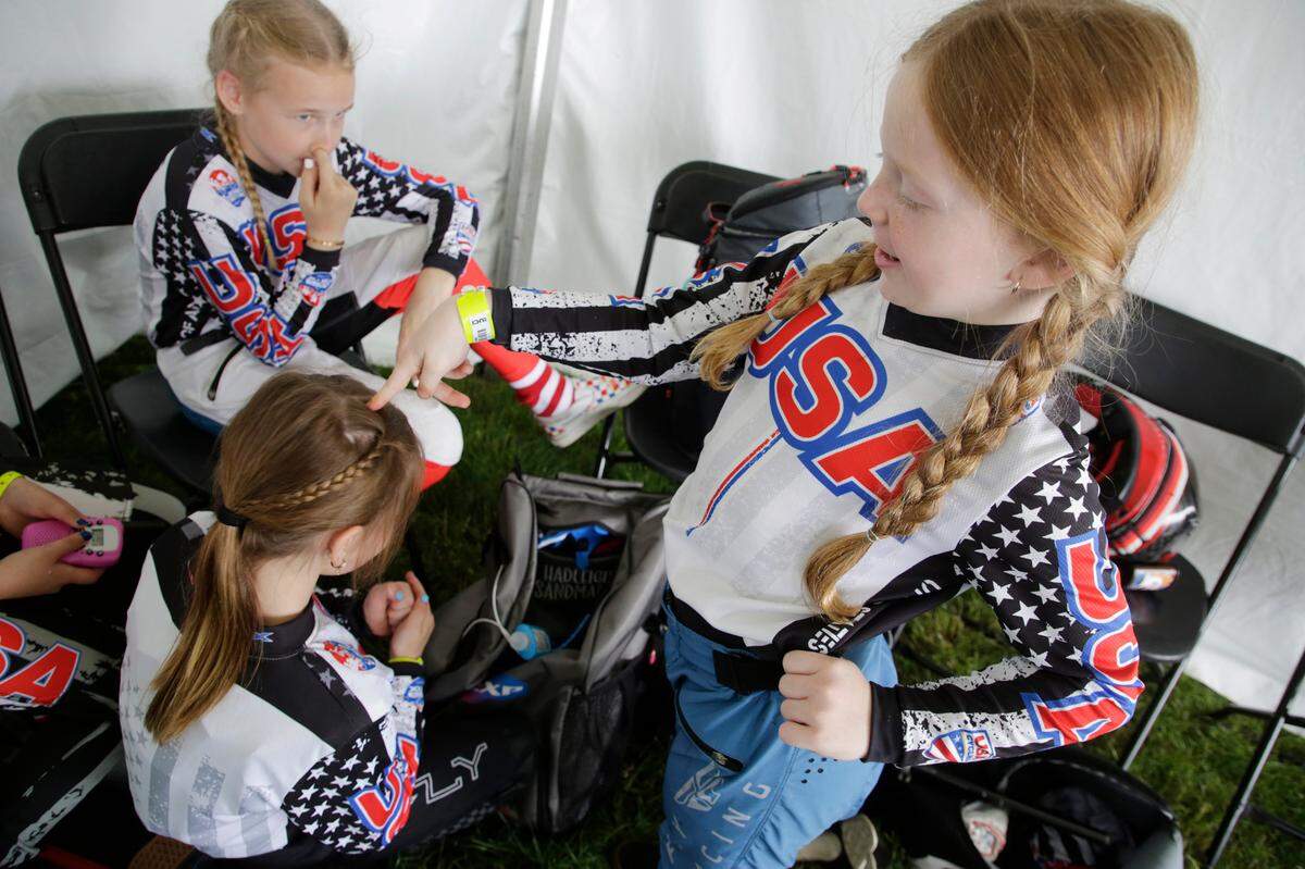 8-year-old Irelyn McGinley plays with teammates before racing alongside them Monday at the BMX World Championships in Rock Hill.