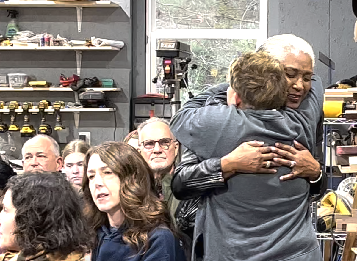 Mary Sanders Lazenby, left, hugs Anne Lowry Jordan Saturday at a ceremony for 144 enslaved people found on Lazeby’s property.