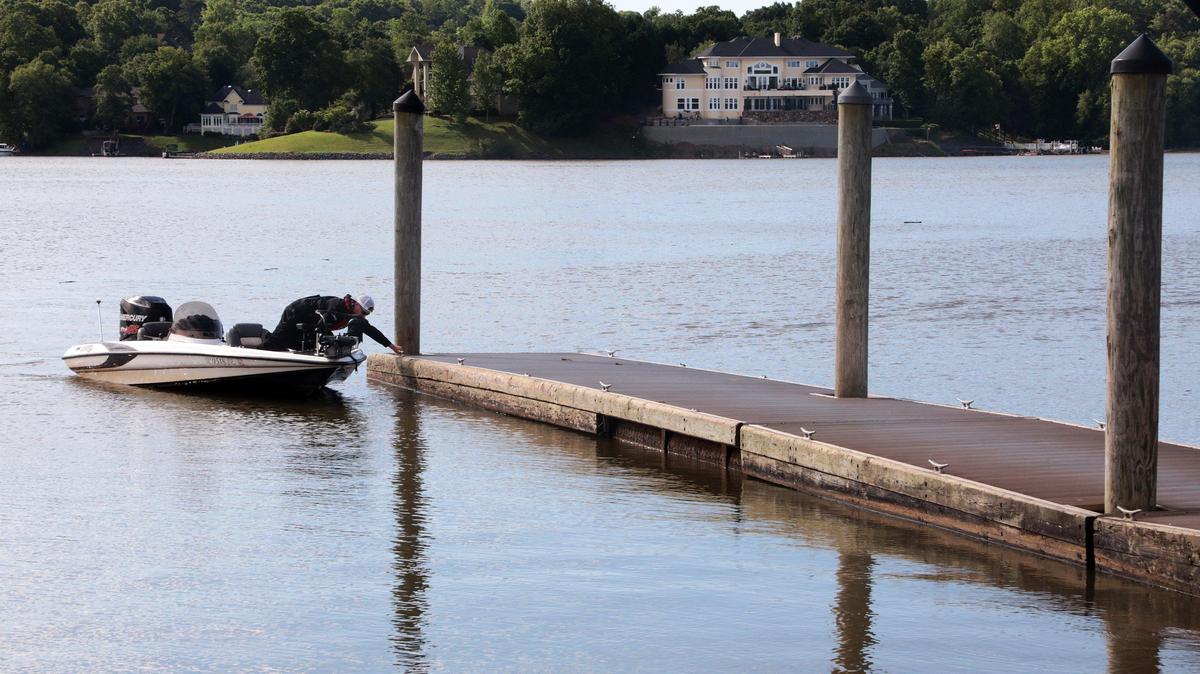 Axl Bartlett returns to a boat ramp near the Buster Boyd Bridge Friday after fishing on Lake Wylie.