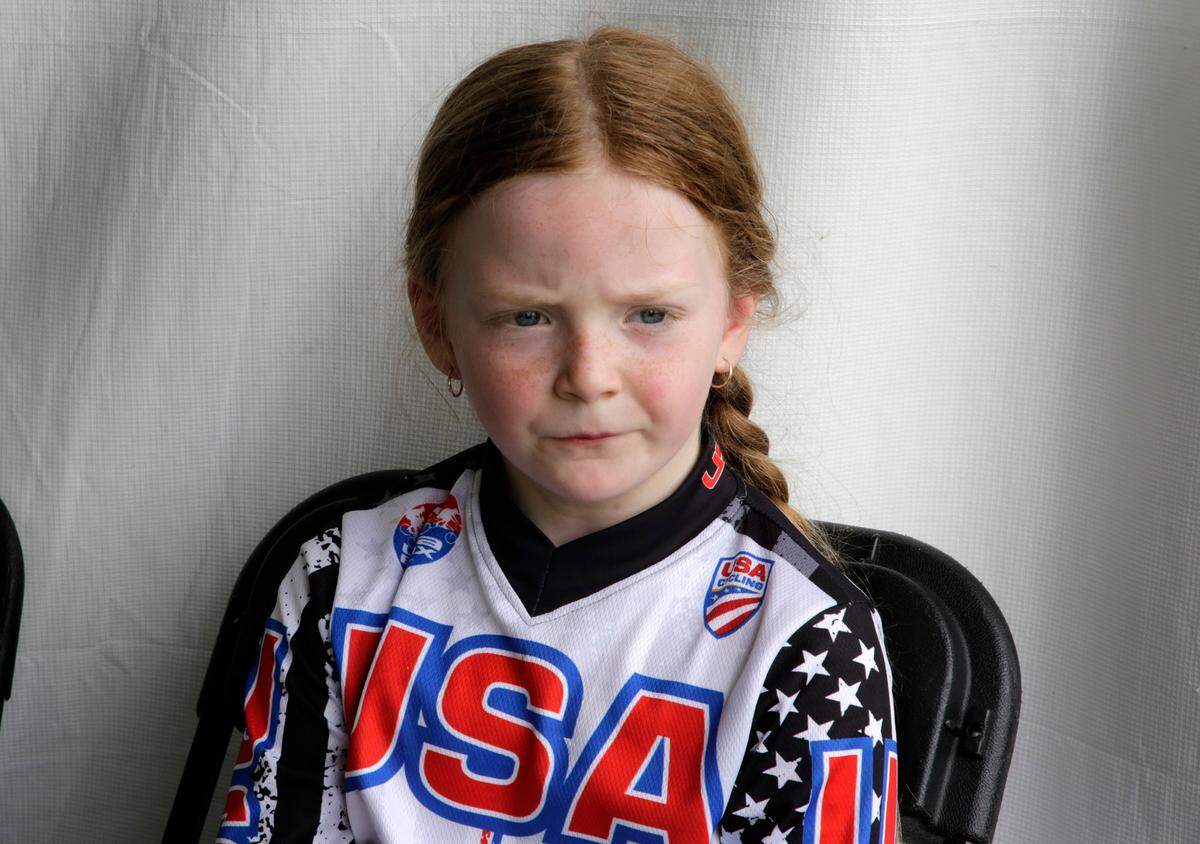 8-year-old Irelyn McGinley rests before racing Monday at the BMX World Championships in Rock Hill.