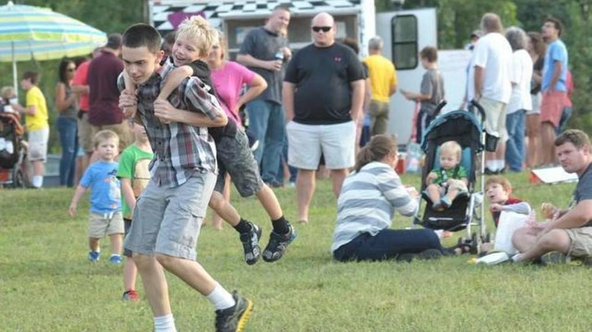 
Jacob Holder takes Parker Nalley for a spin during the first Tawba Fest outdoor festival at Riverwalk.
