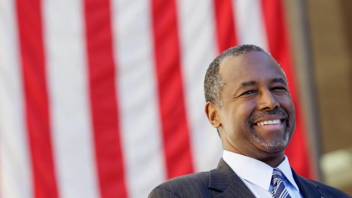 
Republican presidential candidate Dr. Ben Carson looks on as he is introduced to speak at a town hall meeting, Friday, Oct. 2, 2015, in Ankeny, Iowa. 
