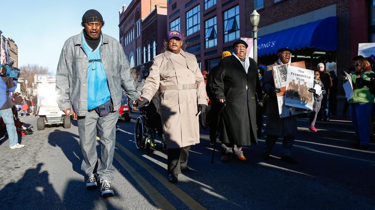 From left, Mack Workman, Willie McCleod, Clarence Graham and WT “Dub” Massey walk on East Main Street in Rock Hill as they commemorate the 54th anniversary of their 1961 arrest at a downtown Rock Hill lunchcounter.
