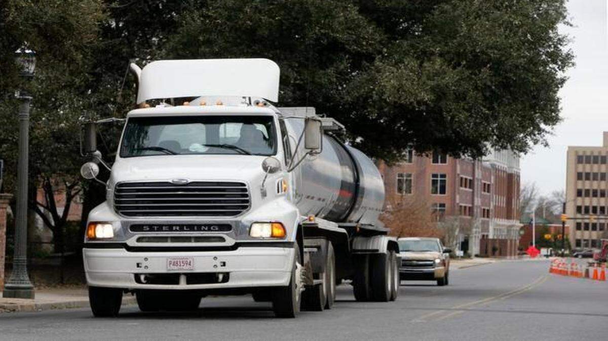 
A tractor-trailer truck waits to turn from Elizabeth Lane onto White Street in downtown Rock Hill on Monday. A measure to restrict large trucks from passing through certain streets in downtown will go into effect if it receives approval at a second and final reading at the next  council meeting.
