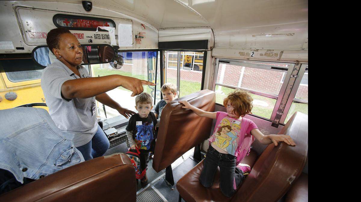 
Bus driver Pearlie Abel watches as students get on her bus at Mount Holly Elementary School in Rock Hill last year. Abel has been named South Carolina School Bus Driver of the Year.
