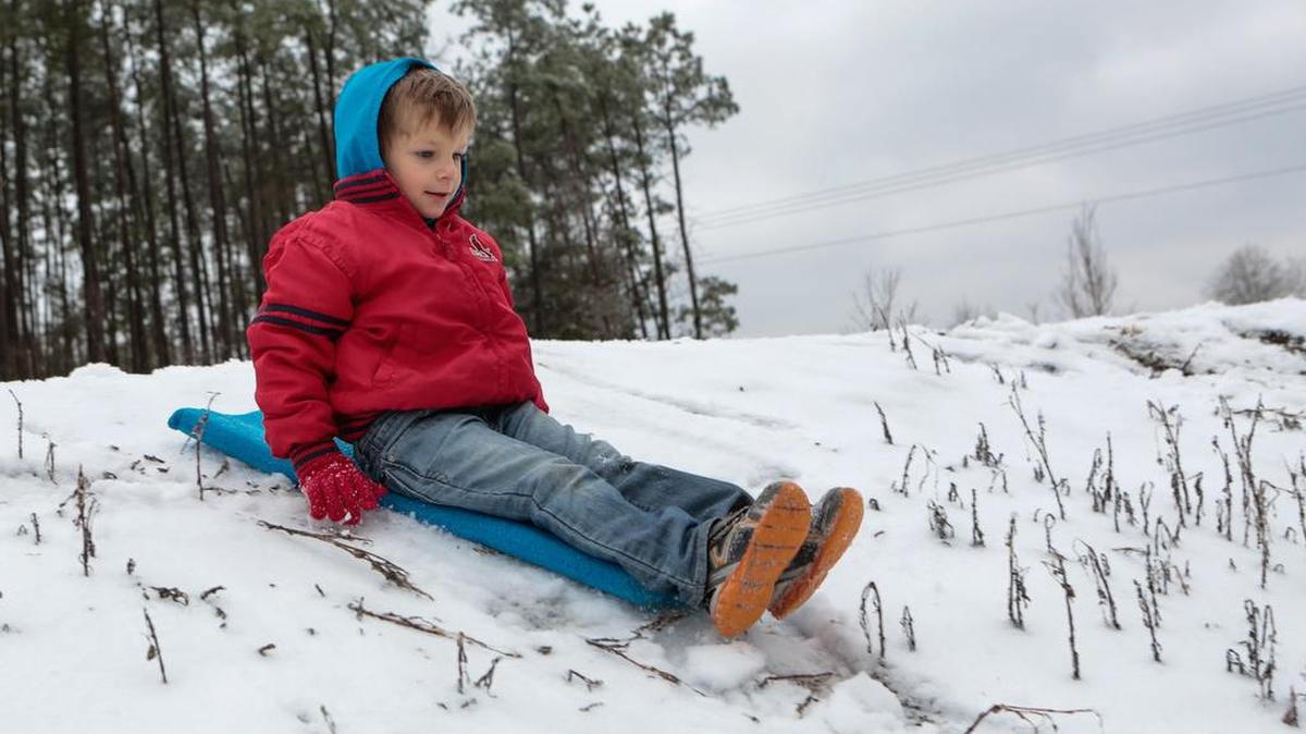5-year-old Chayce Rowe gets ready to sled down a hill in the Lake Wylie area as a winter storm left a blanket of snow and ice across York County Friday.