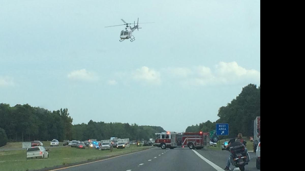 
A helicopter lands on Interstate 77 in Chester County on Sunday. Two choppers were needed to fly out two people who were severely burned when their motorcycle was struck by a car near mile marker 65.
