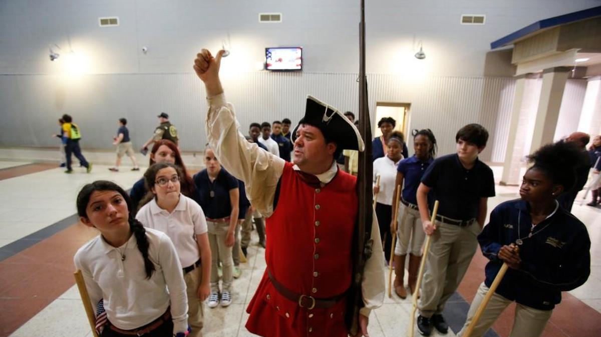 The annual Veterans Commemoration event at Saluda Trail Middle School in Rock Hill was held Monday. Many displays, speakers and performances taught students about military veterans and active duty military personnel. Robert Ryals of Fort Mill, dressed as a South Carolina militia member during the Revolutionary War, is with the New Acquisition Militia Education Association. He was teaching students how the militia drilled in 1780.