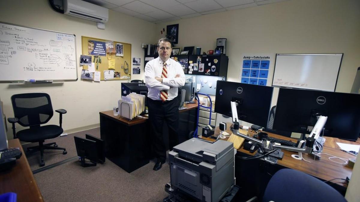 Photos of the solicitor's office inside the Moss Justice Center in 2015, showing its cramped confines and potential danger points. Solicitor Kevin Brackett shows another cramped office for two people.