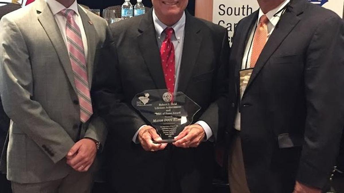 Rock Hill Mayor Doug Echols (center) is joined by SCRPA President Eric Stewart (left) and Rock Hill Parks, Recreation & Tourism Director John Taylor (right) following the award presentation.