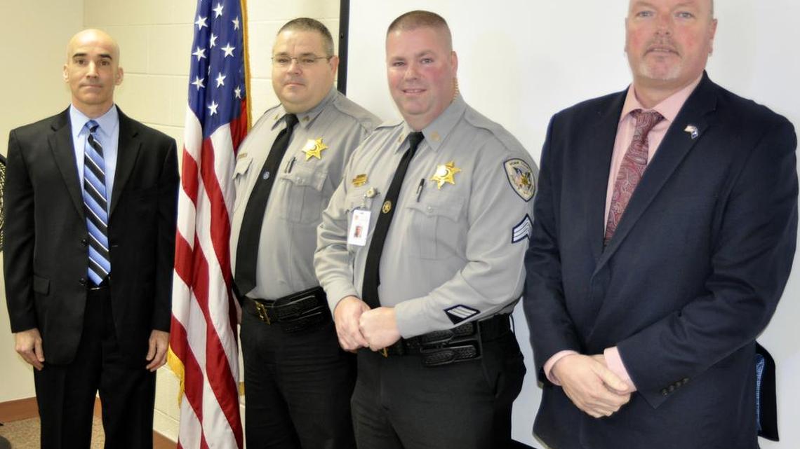 Terry Vinesett and Phillip Aldridge, sergeants with the York County Sheriff’s Office, received Awards of Merit for their first federal human trafficking case in South Carolina. At left is Special Agent Dave Dawson of the FBI in Charlotte, N.C., and at right is Sheriff Kevin Tolson.