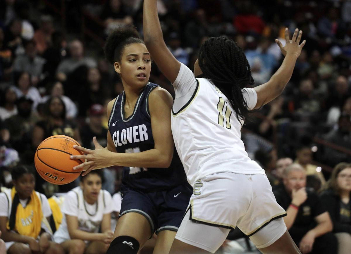 Clover’s Nysheria Wright looks for an opening around Goose Creek’s Aniyah Oliver Friday at the South Carolina Girls 5A State Championships in Columbia.