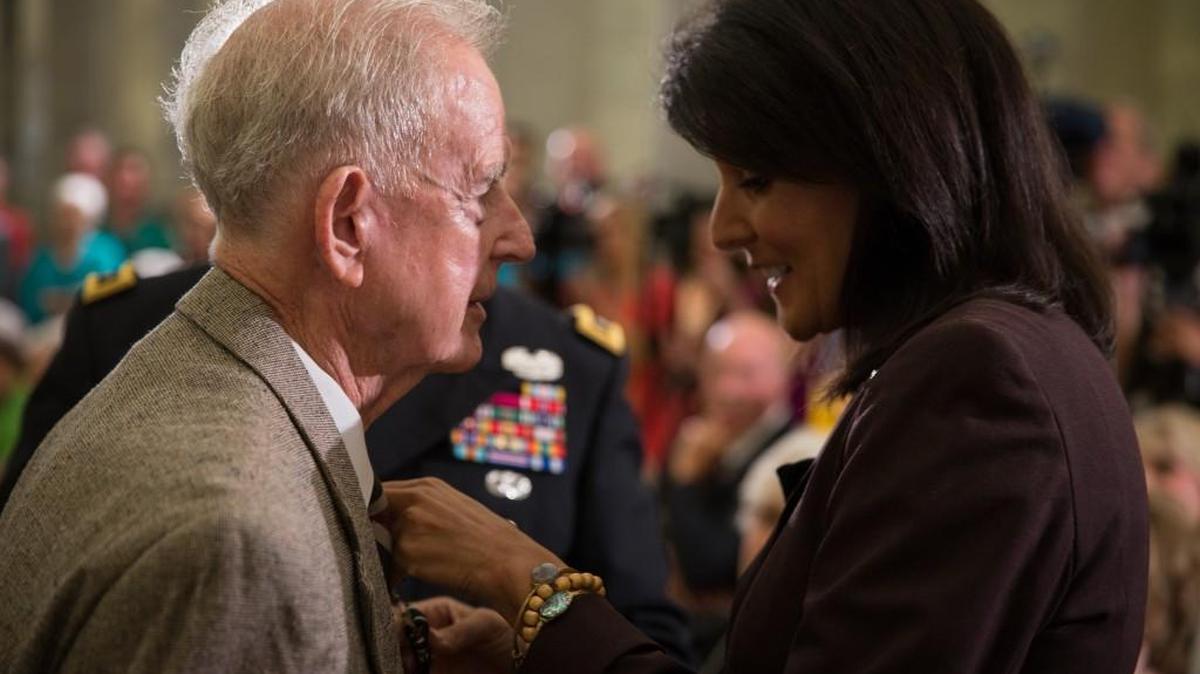 In September 2015, Gov. Nikki Haley presented Paul Luckadoo, left, 12 other World War II veterans and seven WWII veterans’ widows with the newly-created South Carolina Prisoner of War Medal during a Statehouse ceremony in Columbia.
