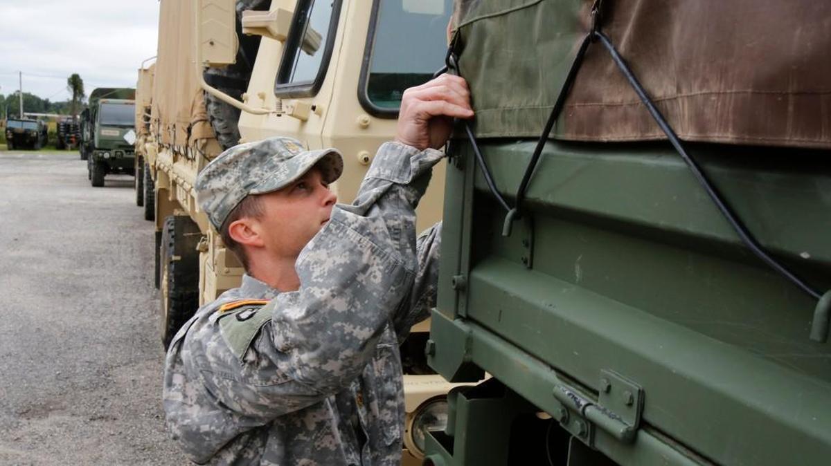 
Combat engineer units from the Rock Hill-based National Guard battalion were activated to assist with 2015 flood recovery in South Carolina. Major Thomas Meares checks one of the military vehicles at the armory in this October 2015 file photo. 

