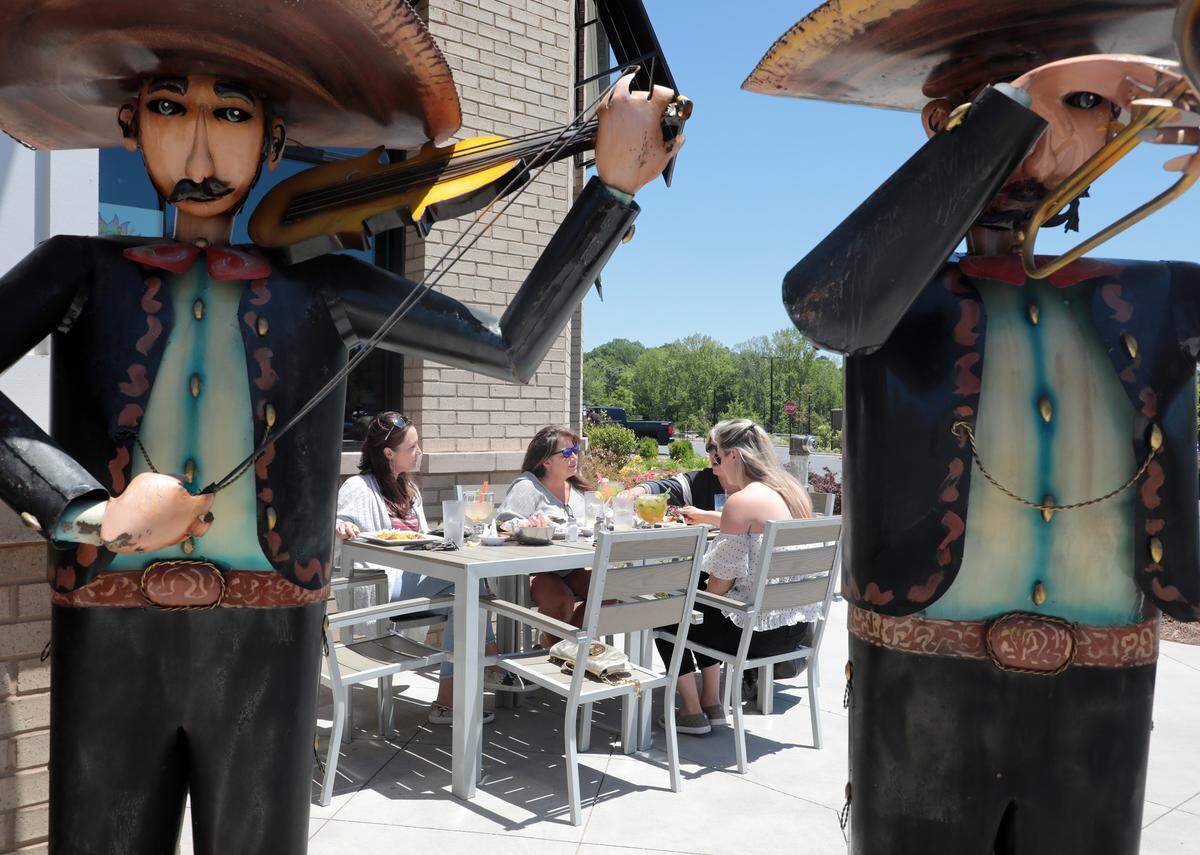 From left, Stacey Wiley, Shelley McGreevey, Becky Hall and Stephanie Harris eat outside Monday at a Mexican restaurant in Indian Land.
