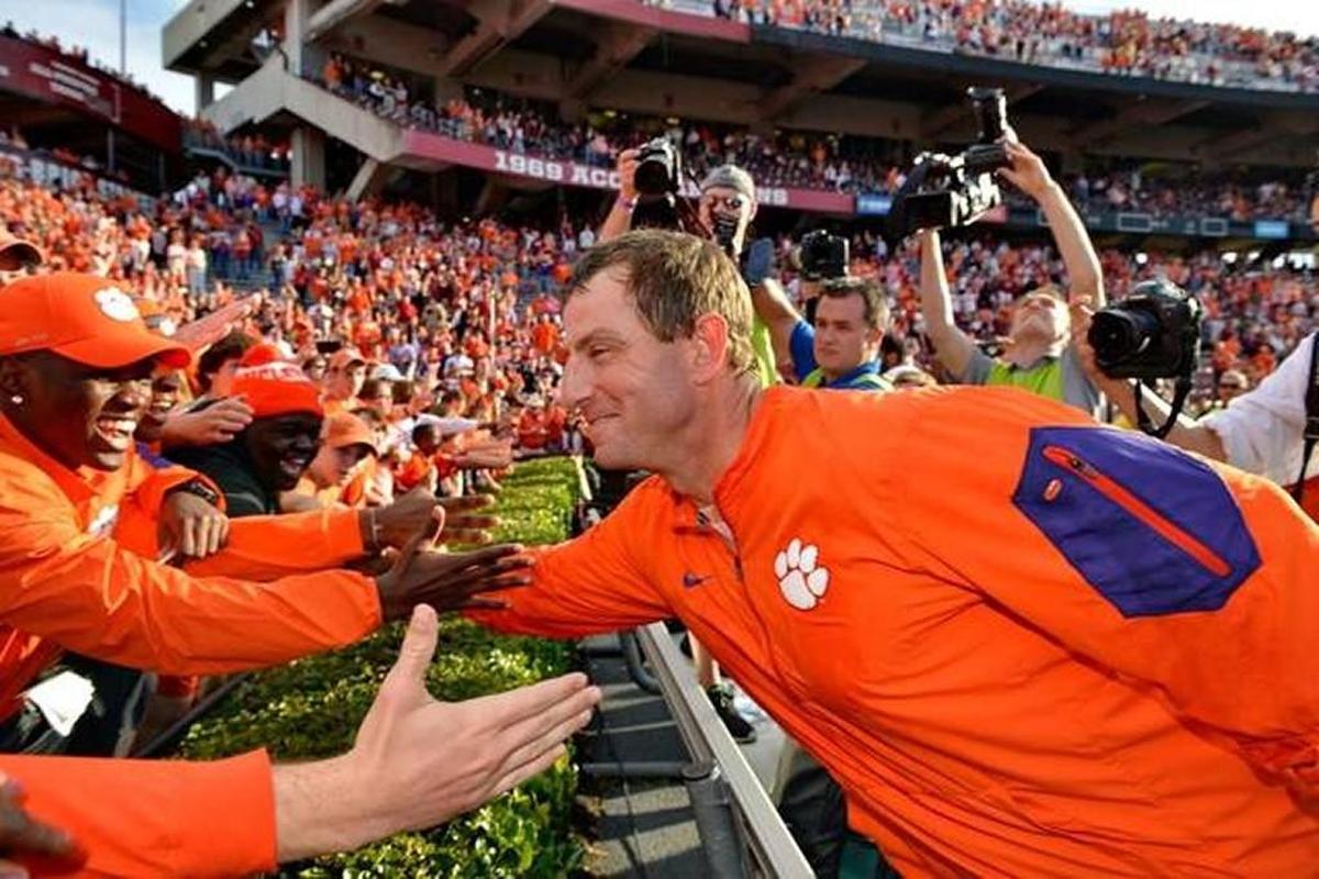 Clemson head coach Dabo Swinney celebrates with the fans after a 37-32 win over South Carolina in 2016.