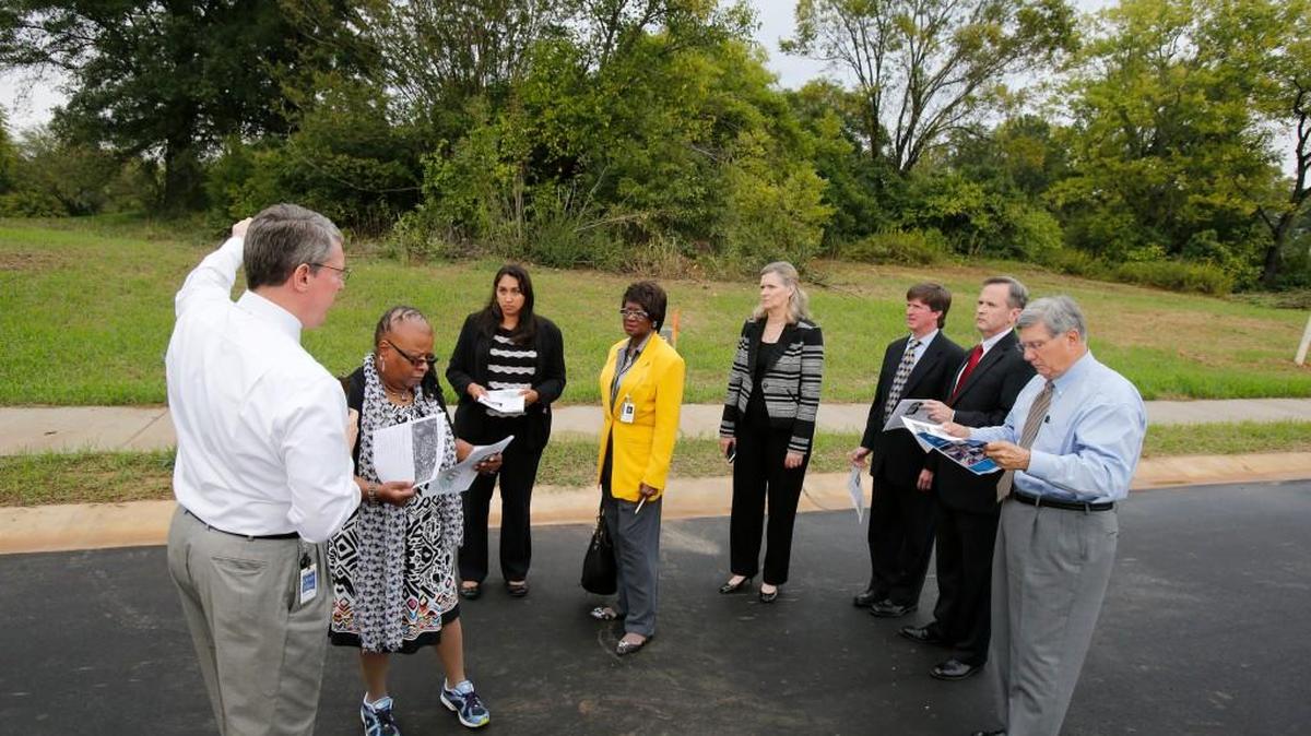 
Rock Hill City Council members joined city staff for a tour the Hagins-Fewell neighborhood by bus Monday. From left are City Manager David Vehaun, council member Sandra Oborokumo, city project manager Jennifer Wilford, council members Ann Williamson, Kathy Pender, John Black, Jim Reno and Mayor Doug Echols.
