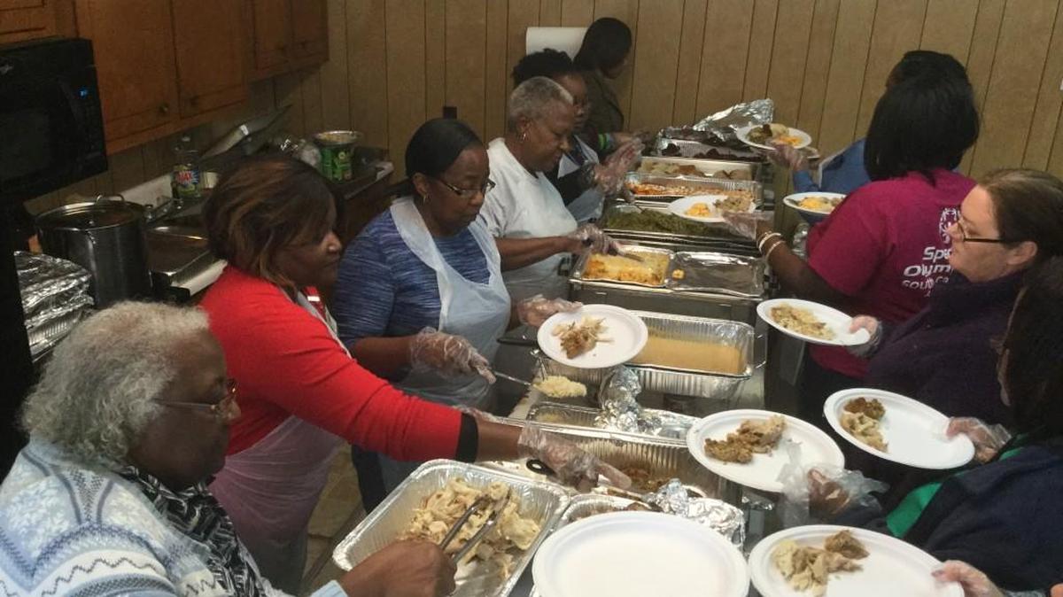 Nearly 200 people took part in a special Thanksgiving meal Tuesday at Cedar Grove Baptist Church in Chester County. Co-founder Bobby Brown, left, is shown serving guests.