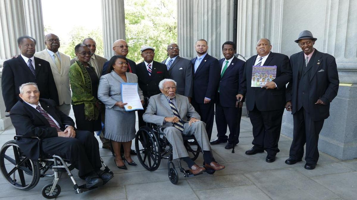 
The Friendship Nine gathered with family members, supporters and lawmakers outside the South Carolina Statehouse on Tuesday. Back left to right: Rep. Carl Anderson, David Williamson, Ella Wells (wife of James Wells), Charles Taylor, Herman Gaither (brother of Tom Gaither), Dub Massey, Willie McCleod, Rep. John King, Rep. Jerry Govan, Clarence Graham, John Gaines. Front left to right, Brother David Boone, Tracey Carter (daughter of Robert McCullough), and Friendship Nine attorney Ernest Finney. Friendship Nine member Mack Workman did not attend
