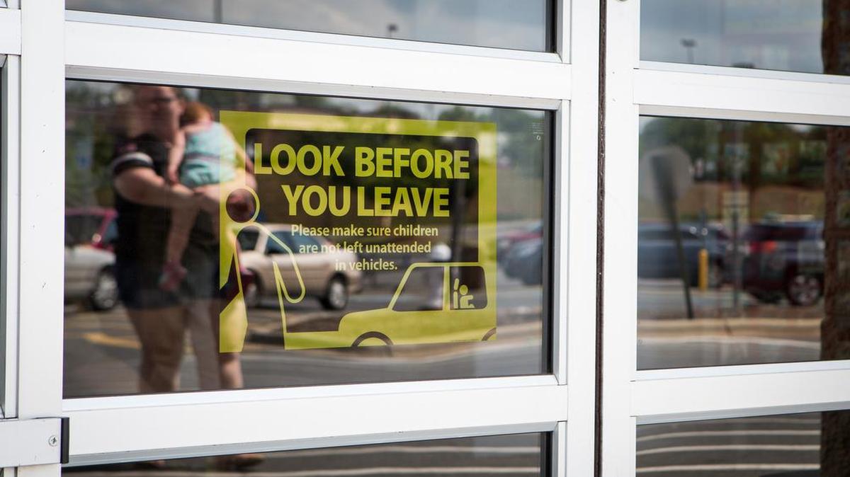 
A sign at the York Walmart reminds shoppers of the dangers of leaving children unattended in a car. 
