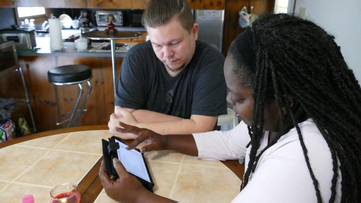 
Chuck Furr and Rosemary Wallace review a copy of South Carolina’s medical marijuana bill on Wallace’s tablet. Both use cannabis medicinally, and are hopeful their stories can spur legislative change.
