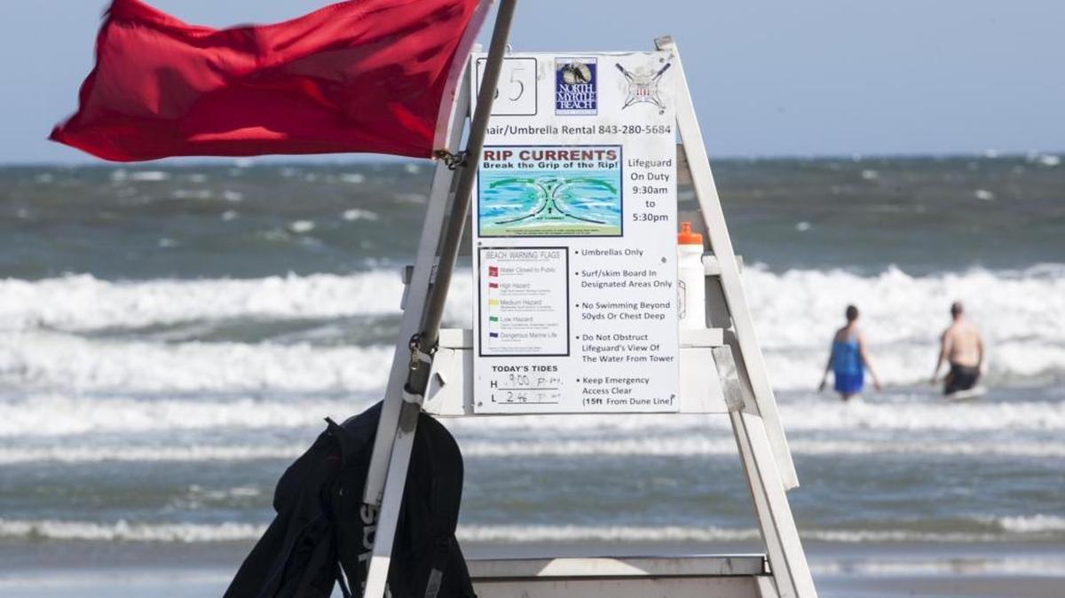 A red flag flies from a lifeguard stand at 12th Ave. South in North Myrtle Beach where a man was treated for a shark bite this afternoon. A 42-year-old Delaware man said that he was bitten on the foot Tuesday afternoon. A witness said he saw the victim yell, jump and stagger as he came in from the ocean with a bleeding foot. The victim was taken to the hospital for treatment.