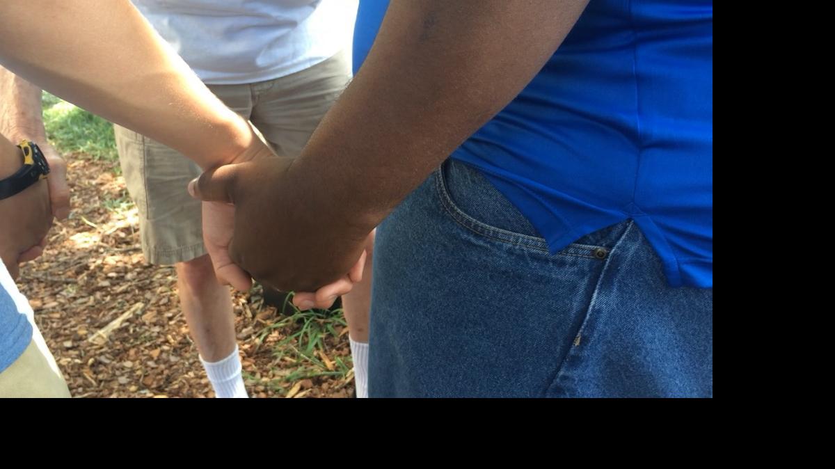
Rally-goers hold hands in prayer outside of the State House Sunday as a part of the Prayer Rally sponsored by local churches.
