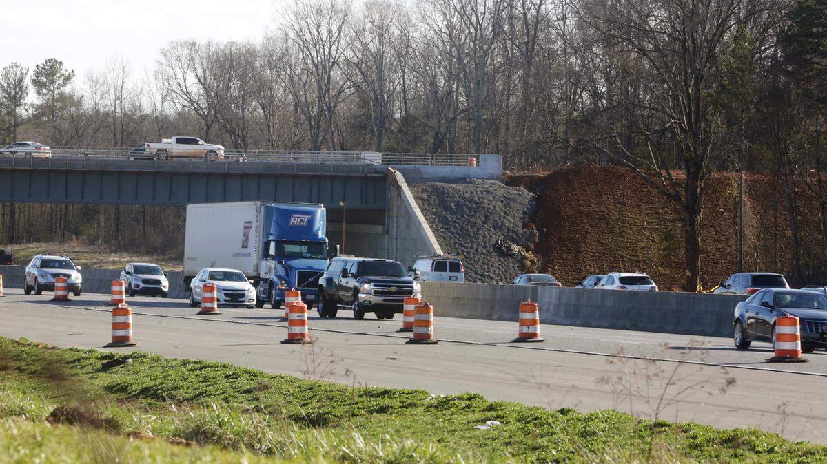 Cars pass under a bridge over I-77 at a new interchange near the former Panthers site. York County and Rock Hill officials had debated whether public money should fund roads from the failed Panthers plan.