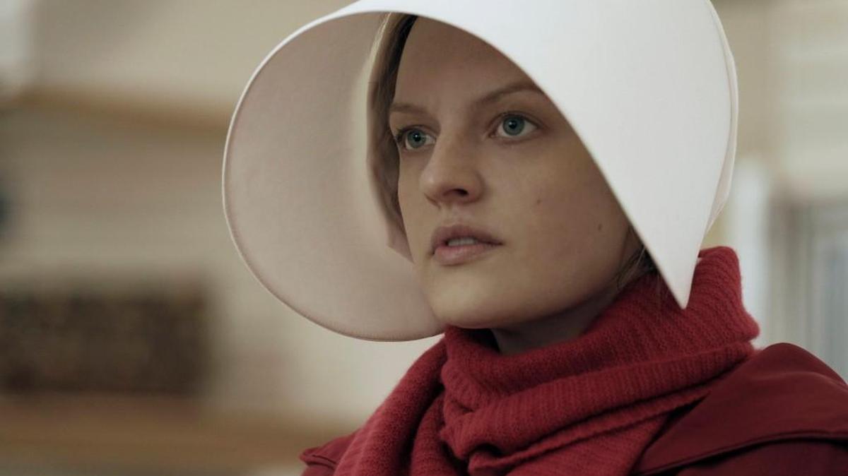 Actress Elisabeth Moss plays Offred in a scene from “The Handmaid’s Tale.”