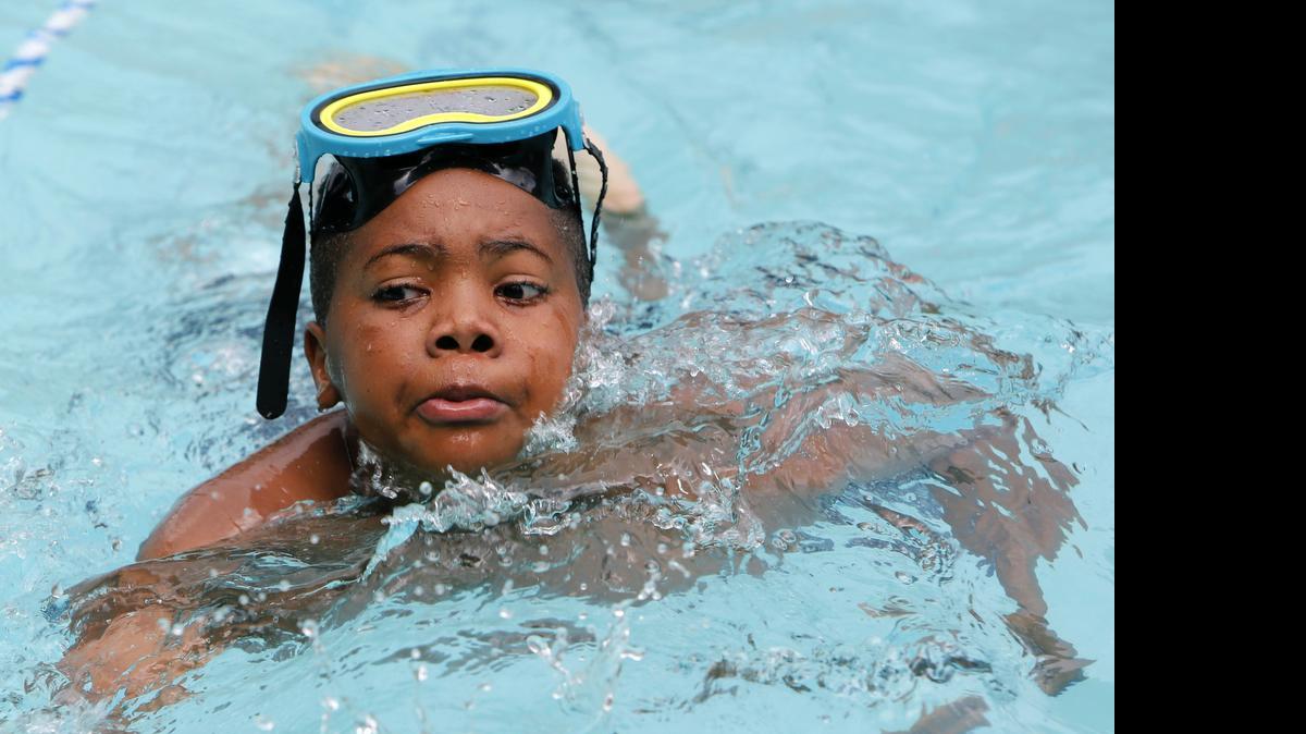 
 DeMarcus Evans, 10, makes his way across the pool at Northside Recreation Center.
