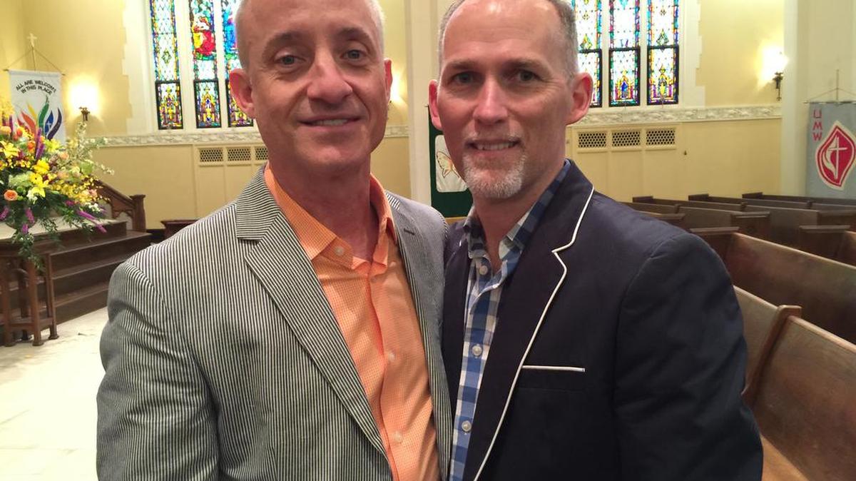 John Romano (L) and Jim Wilborne, both 52 and both of Charlotte, were married Saturday at First United Methodist Church in uptown Charlotte.