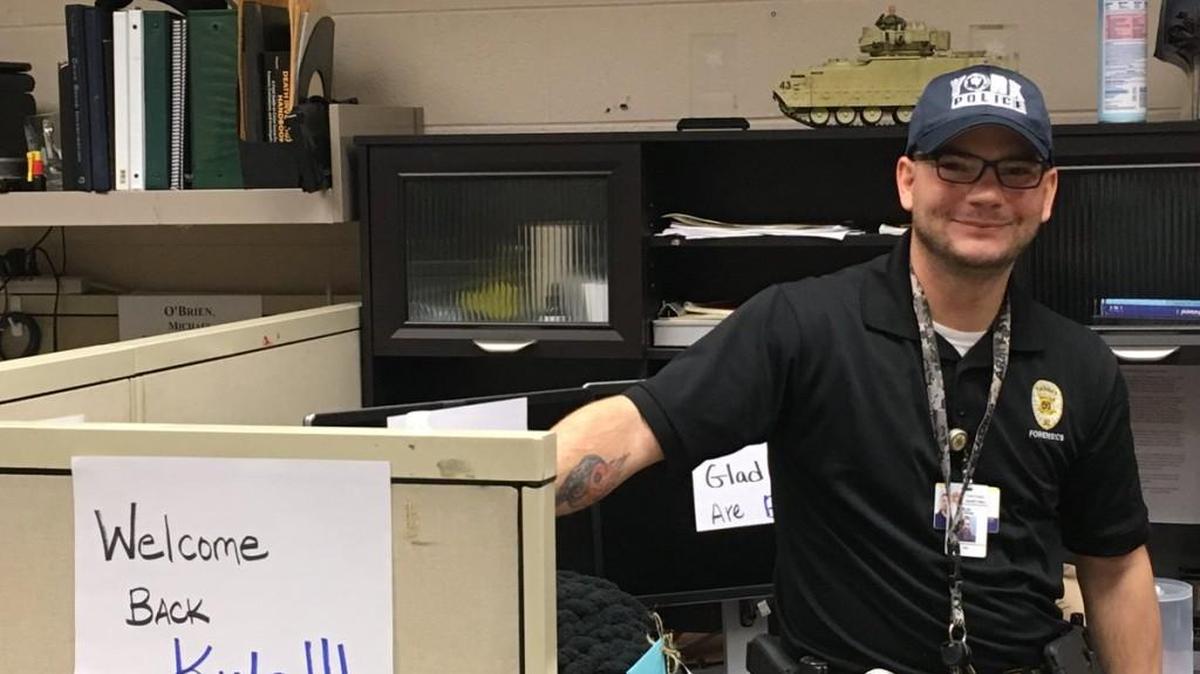 Sgt. Kyle Cummings, who was shot and injured Jan. 16, returned to work Wednesday.