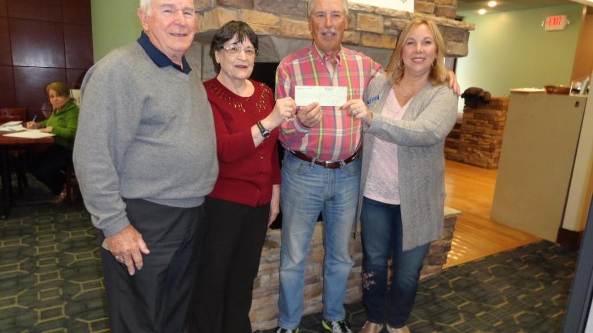 The Fort Mill Men’s Golf Association donated $2,300 to the Fort Mill Care Center, a food pantry and assistance charity that serves the needy in Fort Mill and Indian Land. From left, association member Don Garrett, Fort Mill Care Center Director Carol Higgins, association member Gary Schatz, and care center President Diana Bernard.