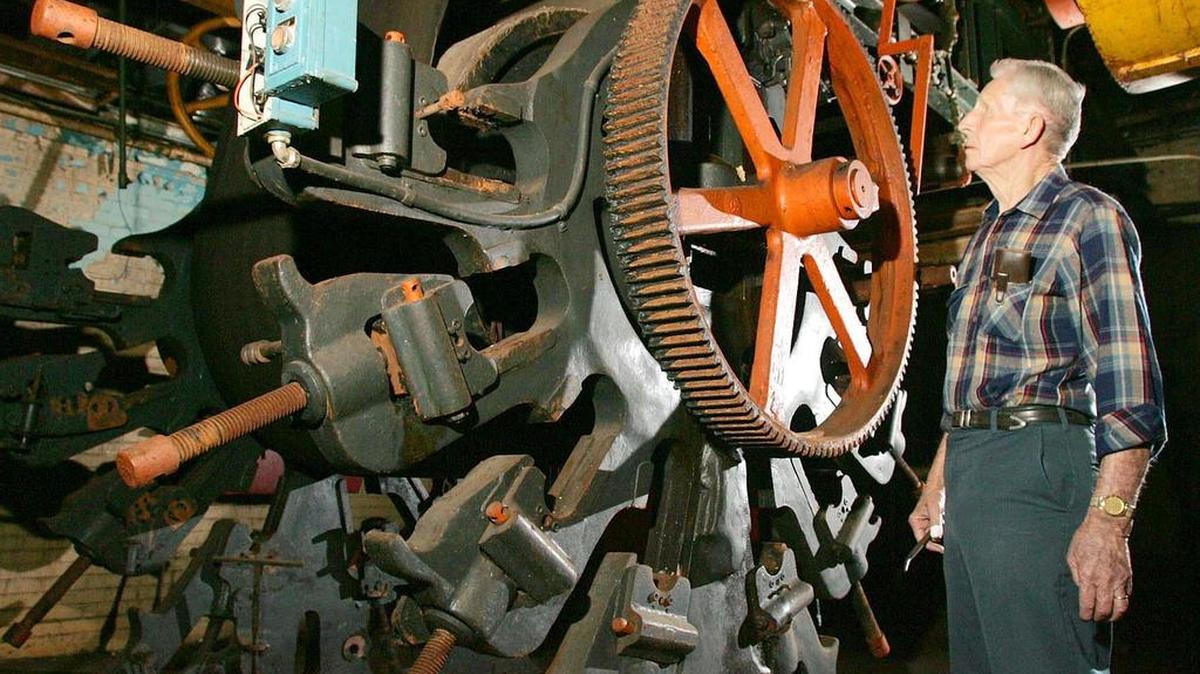 Barnette Nichols, who worked at the Bleachery in Rock Hill for 44 years, is seen looking over the last roller print machine from the original 36 in the plant, on Jan. 6, 2005.