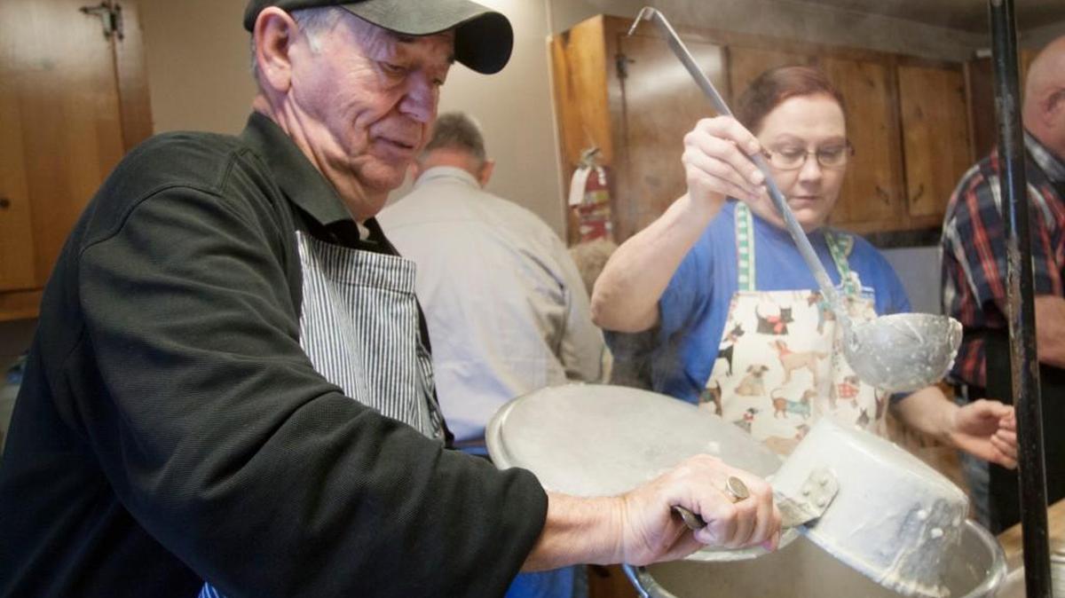 Ellie Grem, left, and Lona Gilmore scoop chicken and rice soup Thursday at Bethel United Methodist Church in Rock Hill at its annual soup kitchen.