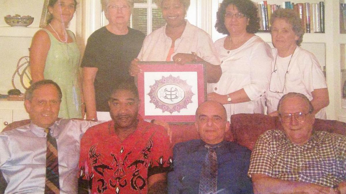 Spiritual Assembly of the Baha'is of Rock Hill from a few years ago, in front from left are Mehrdad Yousefian, Lenzy Woodard, Kamran Borhanian, Doug Phillips. In back from left are Marzieh Yousefian, Donna Moghaddam, Willie Phillips, Sharareh Borhanian, Helen Thomas.