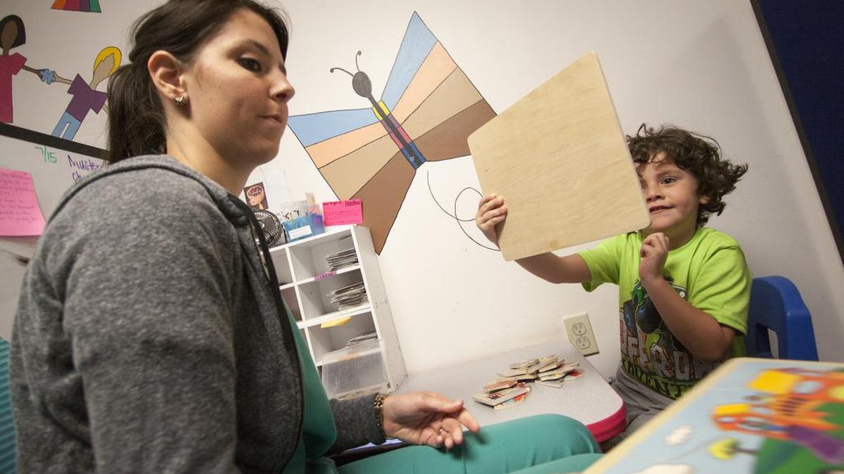 
Therapist Elizabeth Patterson works with a child at the Chrysalis Autism Center in Rock Hill on Monday.

