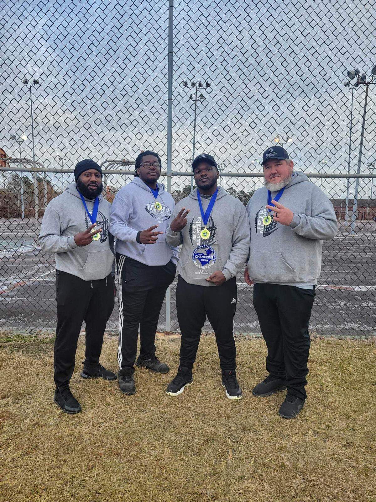 (From left to right) Coaches Stewart Good, Jay Brown, Lawrence “Snoop” Brown and Buster Howard led the 10U Rock Hill Allstars to their second straight state championship with a 6-0 victory over Florence Dec. 10. Ty Colvin (not pictured) led the 8U team to its second-consecutive state championship with a 12-0 win over Easley.