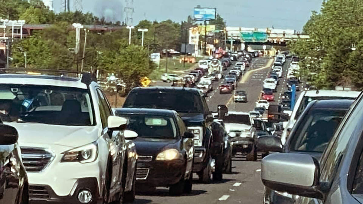 Heavy traffic, shown through a rear view mirror, causes congestion on Celanese Road.