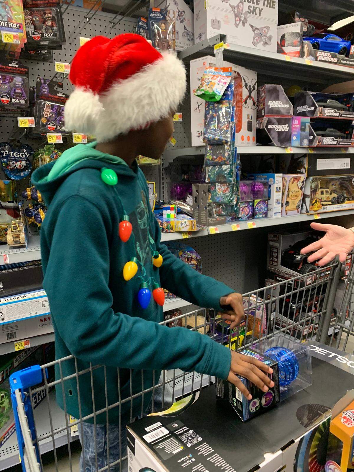 The $400 allocated to each kid comes from community donations. Capt. Roderick Stinson said donations came from everywhere, including police officers and district staff.