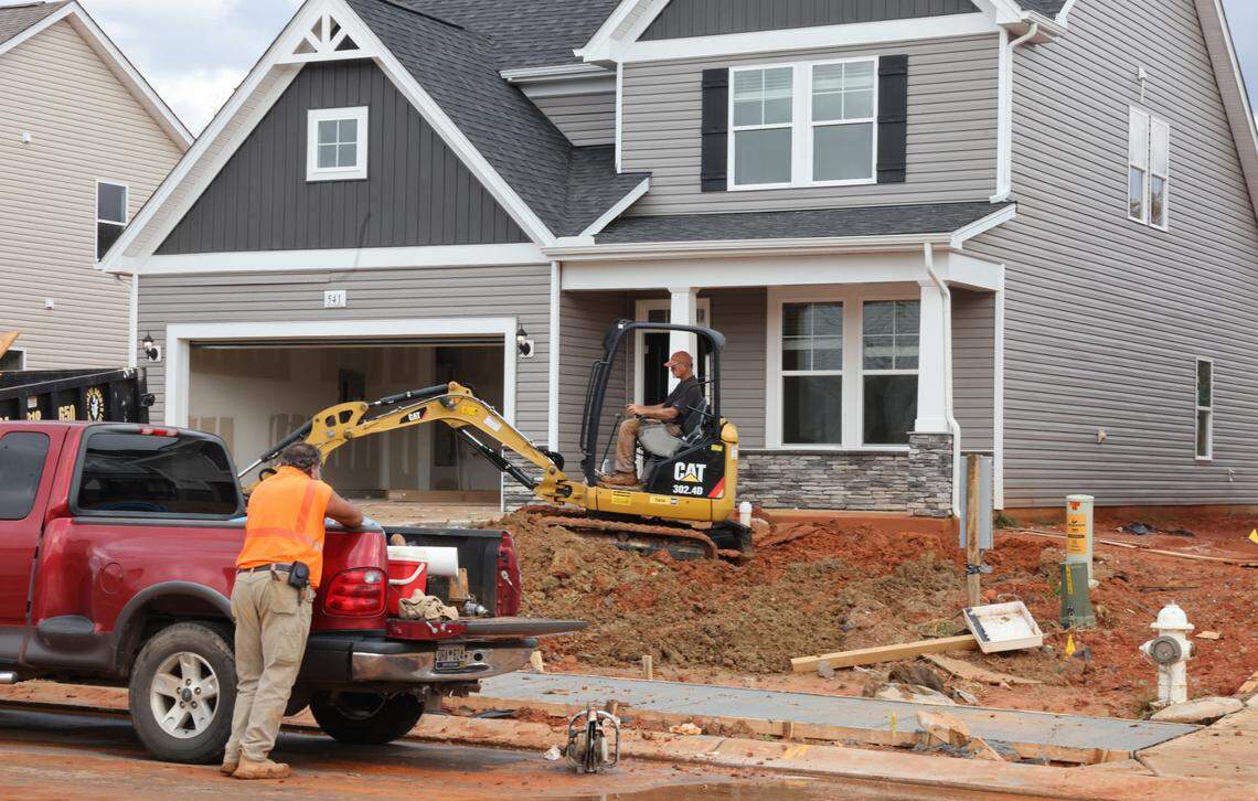 A crew works on a yard of a newly-built home in the Bailey’s Run subdivision in York County. Home sales decreased in counties across the Charlotte region in 2023.