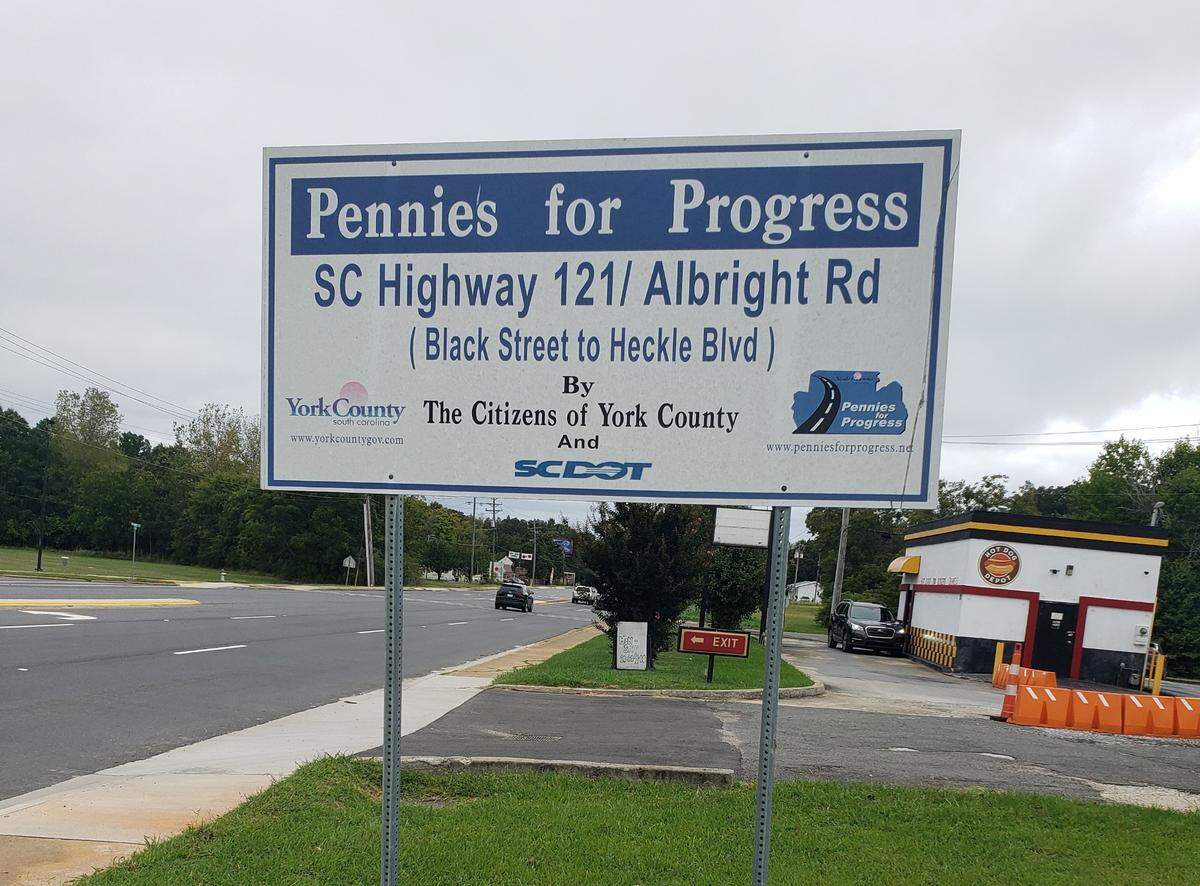 Pennies for Progress signs like this are common in York County, S.C. Voters will decide on Election Day if the tax used to pay road projects will continue.