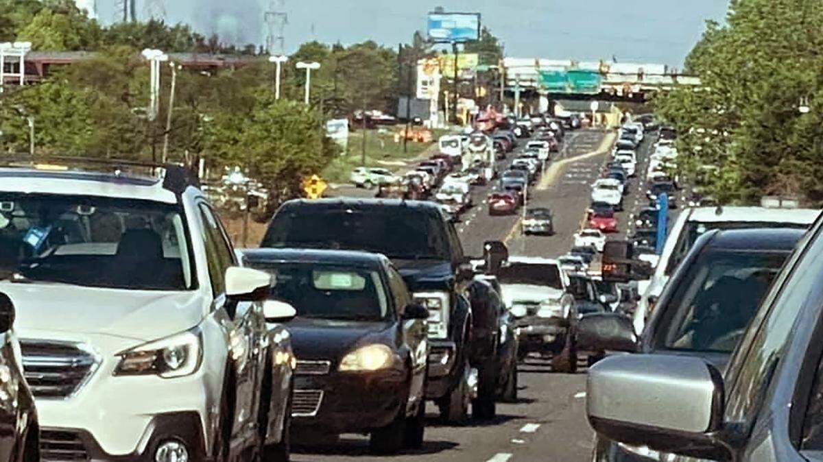 Heavy traffic, shown through a rear view mirror, causes congestion on Celanese Road.