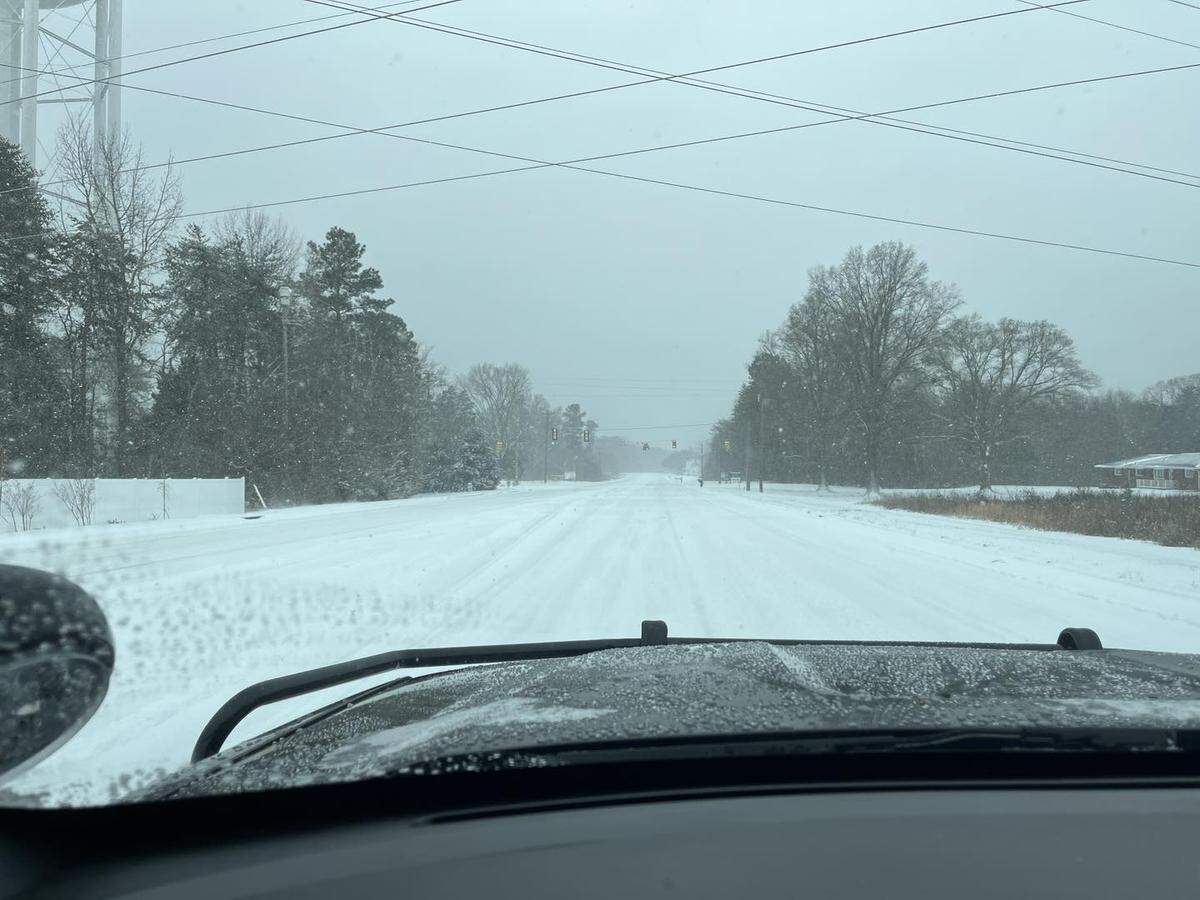 Snow covers Lake Wylie roads on Saturday, as people are encouraged not to drive unless necessary.