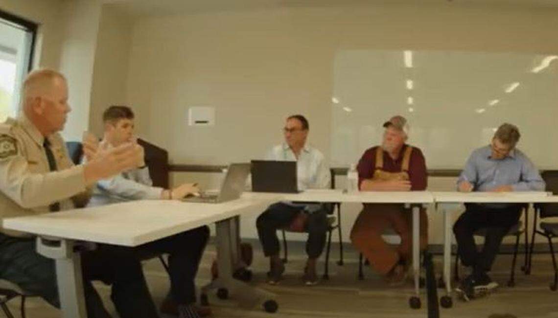 Sheriff Tony Breeden, left, speaks with a county public safety subcommittee on possible changes to hotels, encampments and homes that have repeated emergency calls.