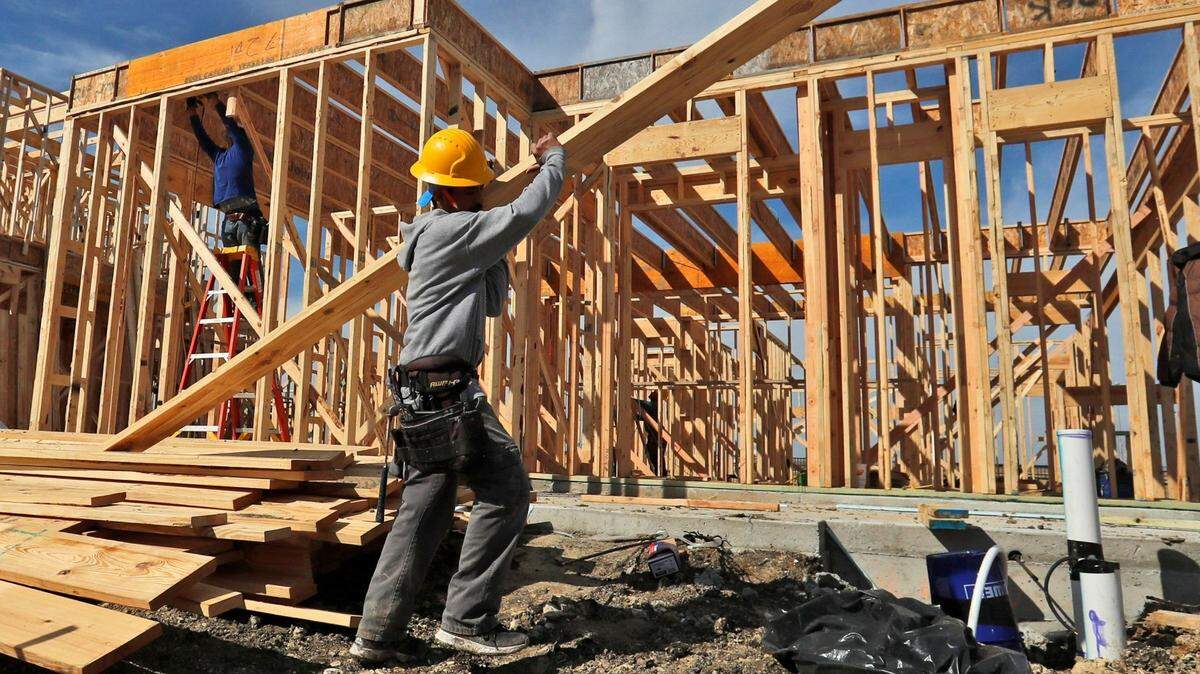 In this Wednesday, Feb. 20, 2019, photo a construction crew works on an already sold new home in north Dallas. On Tuesday, March 5, the Commerce Department reports on sales of new homes in December. AP Photo/LM Otero)