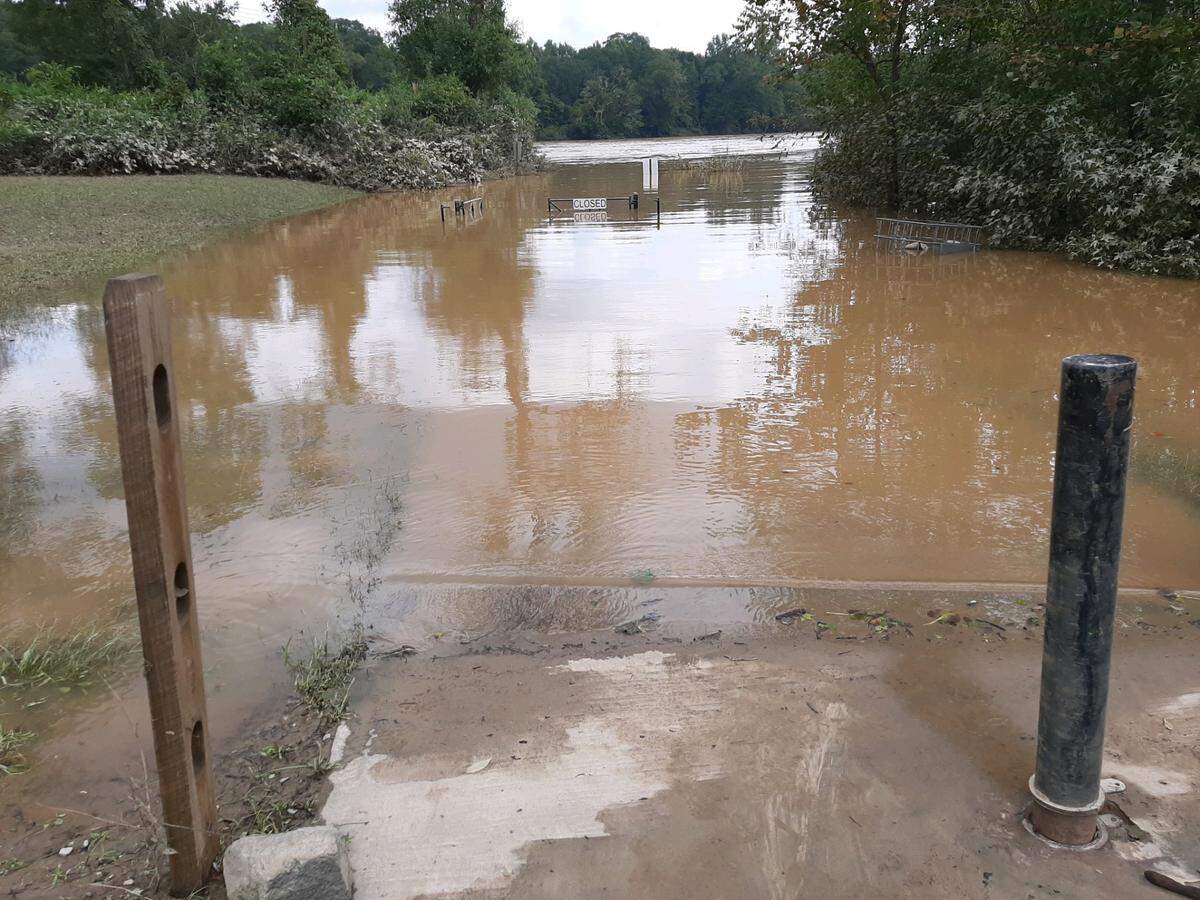 The Catawba River continued to run high, fast and brown on Monday afternoon due to water flowing from Helene. The storm caused sewage spills, including a large on in Sun Cuty in Indian Land.