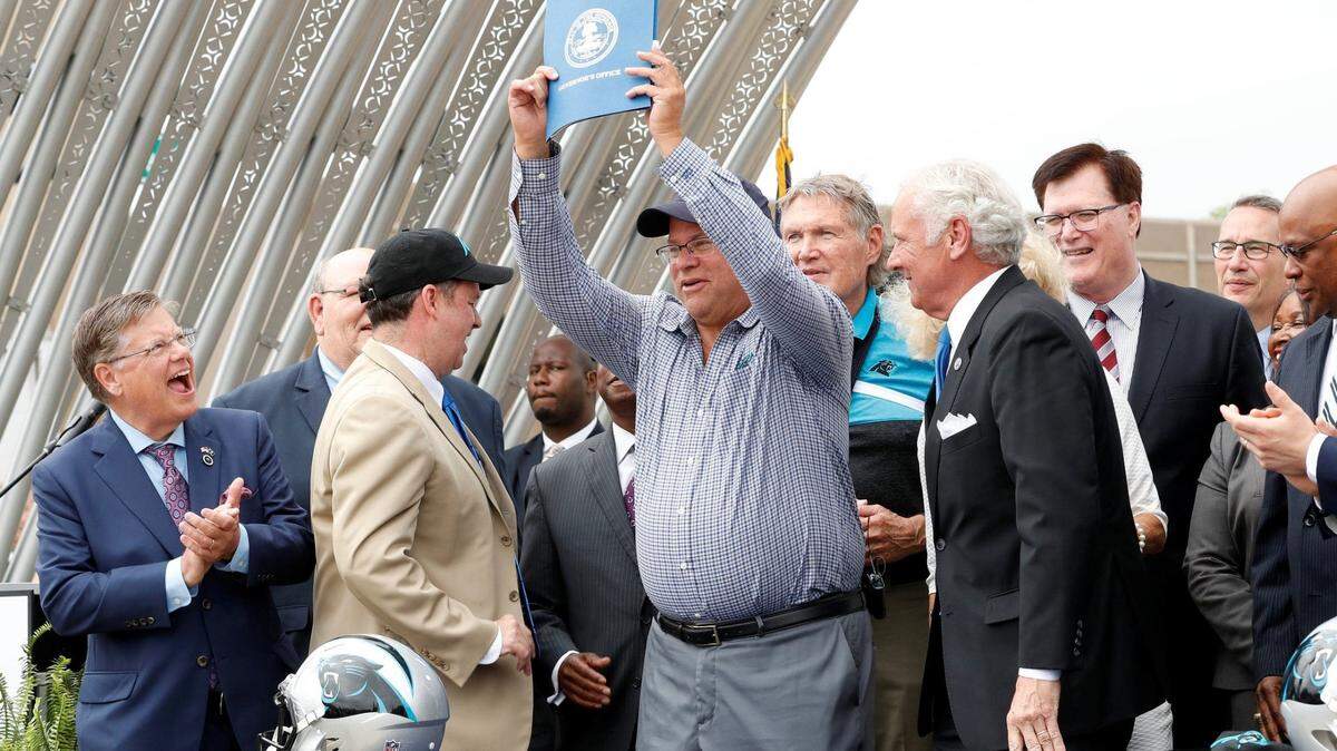 One of the region’s 2020 highlights was the Carolina Panther’s decision to move their practice facility to Rock Hill. Shown here, Panthers owner David Tepper holds up the Professional Sports Team Incentive Act of 2019 as Rock Hill hosted a pep rally in Fountain Park to welcome the Carolina Panthers.