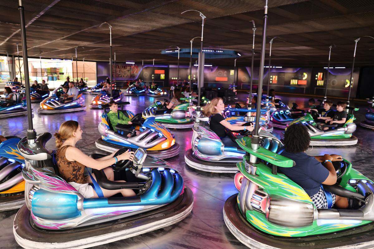 Park-goers at Carowinds ride the Hover and Dodge bumper cars Thursday at Aeronautica Landing.