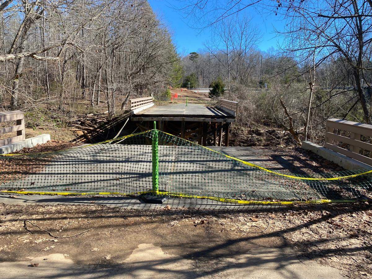A former roadway, used for years as a pedestrian bridge on the Anne Springs Close Greenway in Fort Mill, collapsed due to rain from heavy storms.